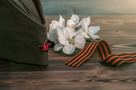 9 may, holiday Victory Day. George ribbon, spring flowers and military cap. copy spaceの写真素材