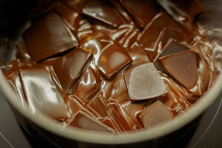 melted dark chocolate. Pieces of chocolate are melted to the state of chocolate sauceの写真素材