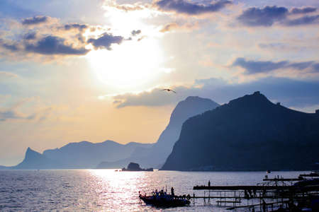 sunset on the Black Sea coast with mountain views. The Crimean Peninsula, the city of Sudak.