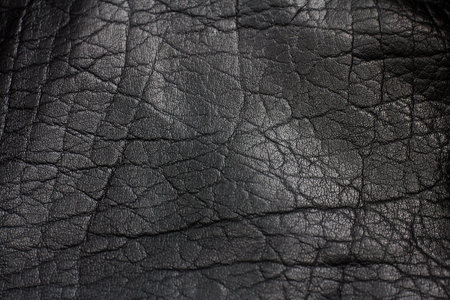 the surface of a black leather thing, close-up skin texture, abstract.の写真素材