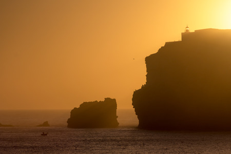 Sunset at the lighthouse of Nazare