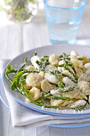 Orecchiette pasta with wild asparagus, mozzarella and Parmesan cheese  Italian food の写真素材