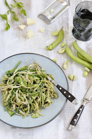 Tagliatelle spinach wild asparagus, fresh beans and Italian cheese  Pecorino Romano   Italian cuisine  の写真素材