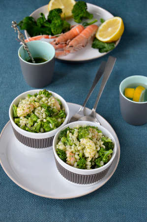 Broccoli salad with pearl barley and Norway lobster Shrimp scampi  の写真素材