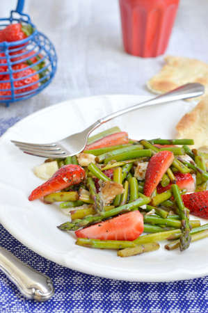 Strawberries and asparagus salad with parmesan cheese, balsamic vinegar and poppy seeds の写真素材