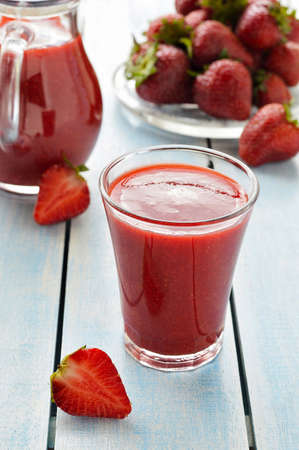 Fresh strawberry smoothie in drinking glass  Decoration  a  carafe of strawberry smoothies, fresh strawberry berries  の写真素材