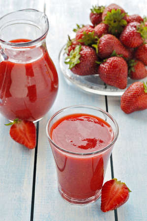 Fresh strawberry smoothie in drinking glass  Decoration  a  carafe of strawberry smoothies, fresh strawberry berries  の写真素材