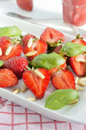 Strawberry salad with basil and pine nuts の写真素材