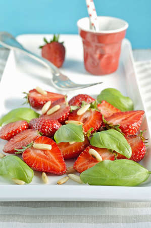 Strawberry salad with basil and pine nuts  Selective focus の写真素材