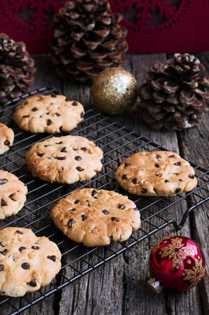 Chocolate Chip Cookies on a metal stand for baking at Christmas Timeの写真素材