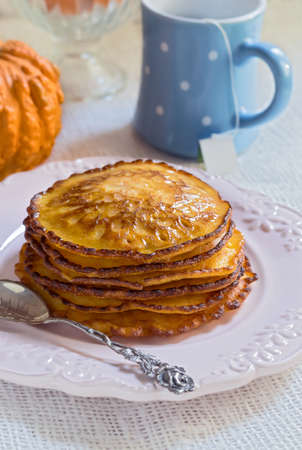 Pumpkin pancakes on vintage plate. Decorated an entire pumpkin.の写真素材