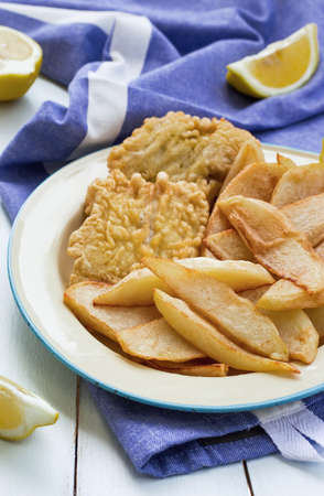 Fried Fish Fillet with Baked Potatoes. Close-up.の写真素材