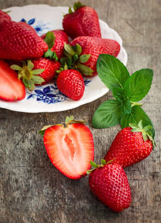 Sweet Red Strawberries with Mint on a Plate, Close-upの写真素材