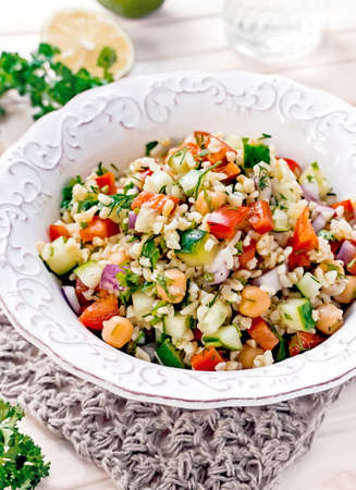 Diet Concept Tabbouleh Salad With Bulgur Wheat, Parsley And Vegetablesの写真素材