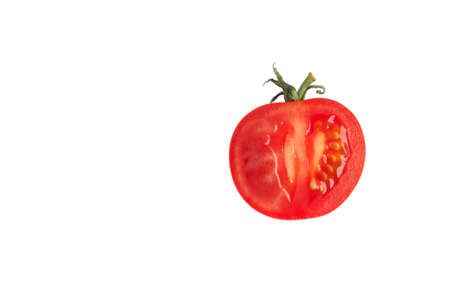 cherry tomato in a cut isolated on a white background. The concept of healthy nutrition, organic food, fresh vegetables, veganismの写真素材