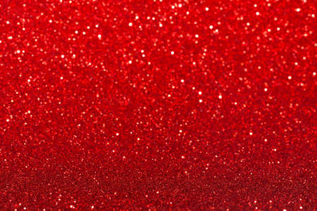 Red festive background with sparkles in the bokeh. The concept of the celebration, the day of St....