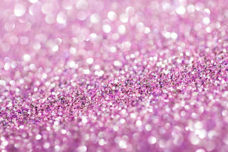 Pink festive background with sparkles in the bokeh. The concept of the celebration, the day of St. Valentine, New Year, birthdays, ceremonies, events, etc.の写真素材