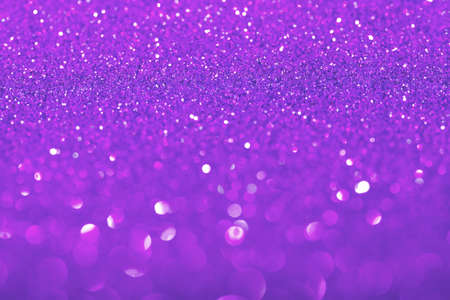 Violet festive background with sparkles in the bokeh. The concept of the celebration, the day of St....