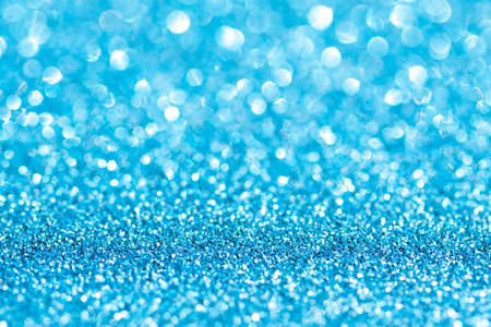 Blue background with sparklesの写真素材
