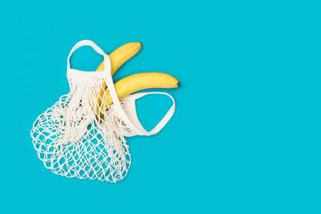 Bananas in eco bag with copy spaceの写真素材