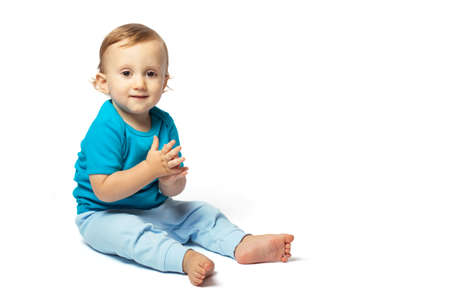 Cute baby boy playing isolated on the white background. Copy place
