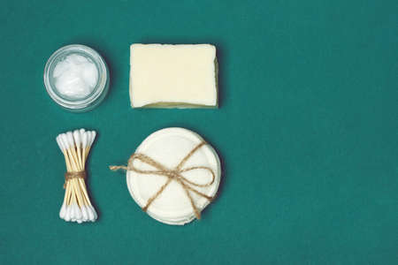 Set of eco-friendly body care items on the green background. Zero waste concept, plastic-free,...