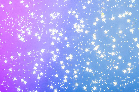 Trendy neon violet and blue background with silver stars. The concept of celebrations, the Day of...