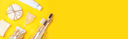 Set of eco-friendly plastic-free body care items on the yellow background. Banner format. Zero waste concept, plastic-free, organic, eco-friendly shoppingの写真素材