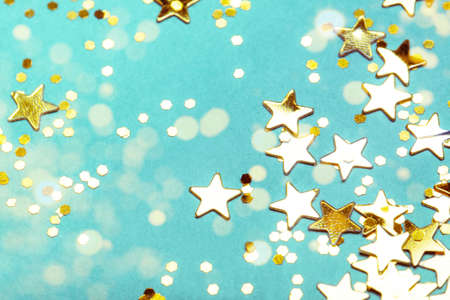 Trendy mint background with golden stars. The concept of celebrations, the Day of St. Valentine, Christmas, New Year, holiday, birthday, etc.の写真素材