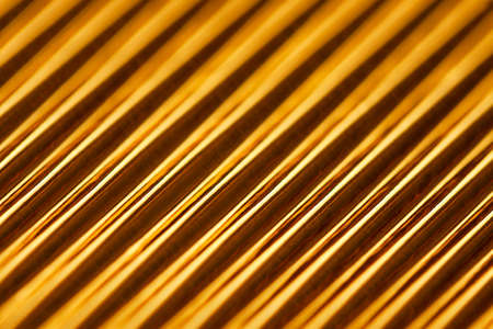 Abstract stylish geometric background. Growing diagonals. Trendy gold color.の写真素材