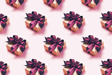 Pattern with stylish gift on a trendy pink background. Present for St. Valentines day, engagements, Mothers Day, birthday, New Year, Christmas, holidaysの写真素材
