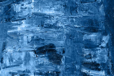 Brushstroke with oil paints in blue color on canvas. Copy space. The concept of a creative...