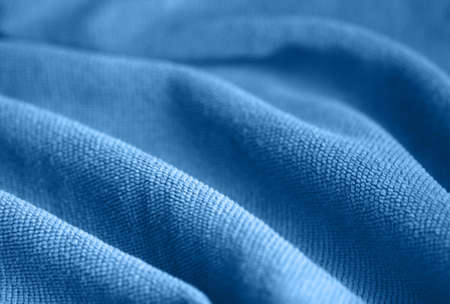 Soft velvet texture. Trendy blue color. The concept of femininity, home comfort, warmthの写真素材