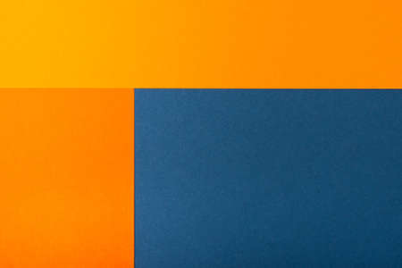 Abstract geometric paper background. Trendy blue and orange colors, active lines.の写真素材
