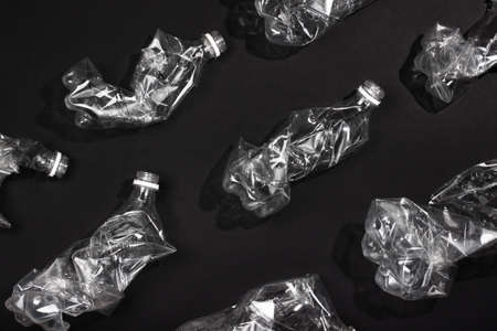 A lot of used plastic bottles on blackの写真素材