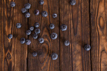 Few bluebarries on the wooden tableの写真素材