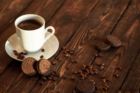 coffee and cookies on a wooden tableの写真素材
