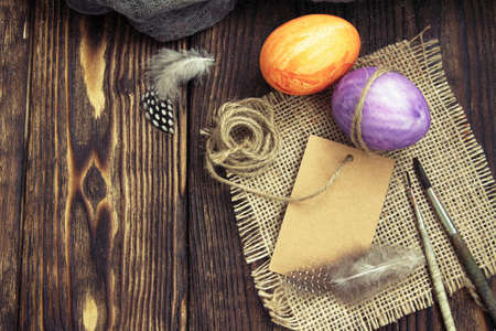 preparation for coloring Easter eggs on a wooden tableの写真素材