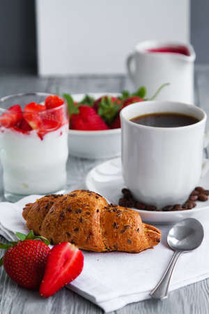 healthy breackfast for healthy Breakfast with delicious croissant and strawberries for early morningの写真素材