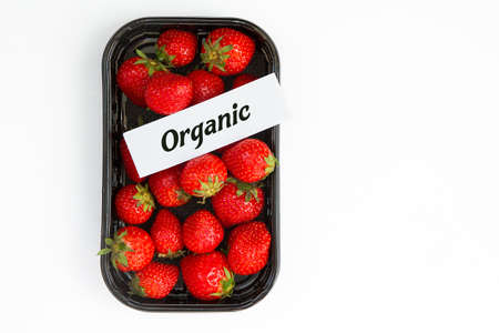 juicy ripe strawberry in supermarket box on white background,copy spaceの写真素材
