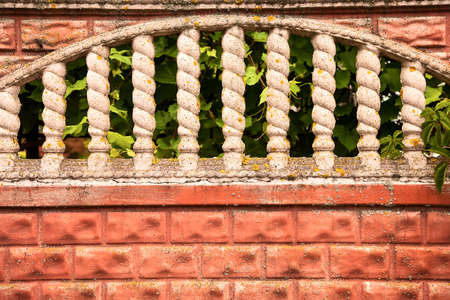 vintage white stone Windows in old red brick wallの写真素材