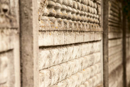 old vintage light grey stone fence, view along the fenceの写真素材