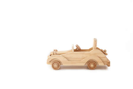 wooden vintage toy car on a white backgroundの写真素材