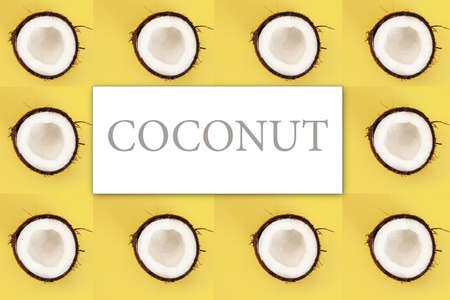 Pattern with half of coconuts on yellow background. Top View,minimalism, creative cocnuts concept.