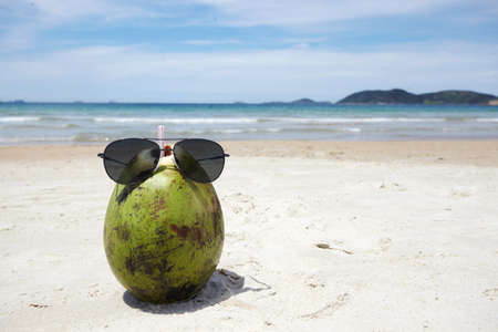 Coconut water on a tropical beachの写真素材