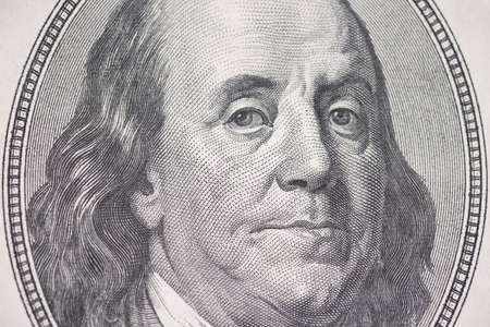 Benjamin Franklin, close-up of a hundred dollar bill, texture. Business and finance. 100 US dollars...