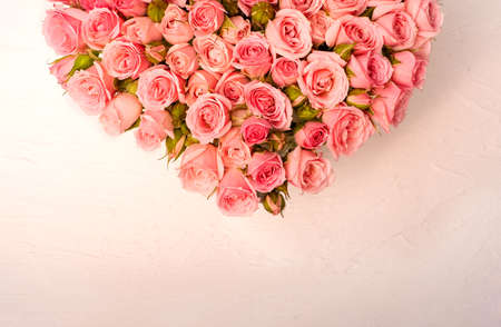 Pink roses on a light background. Valentines Day greeting card