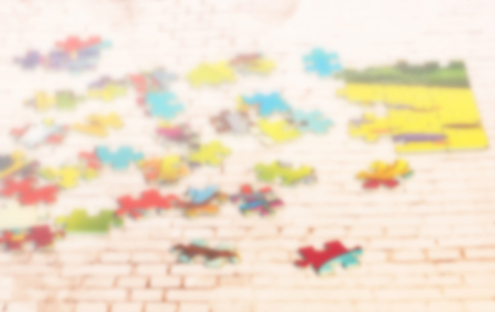 Scattered pieces of the puzzle. Blurred photoの写真素材