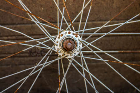 Rusted bike wheel symmetricの写真素材