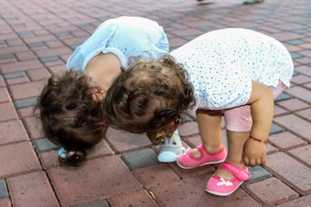 Sweet little girls playing with each otherの写真素材